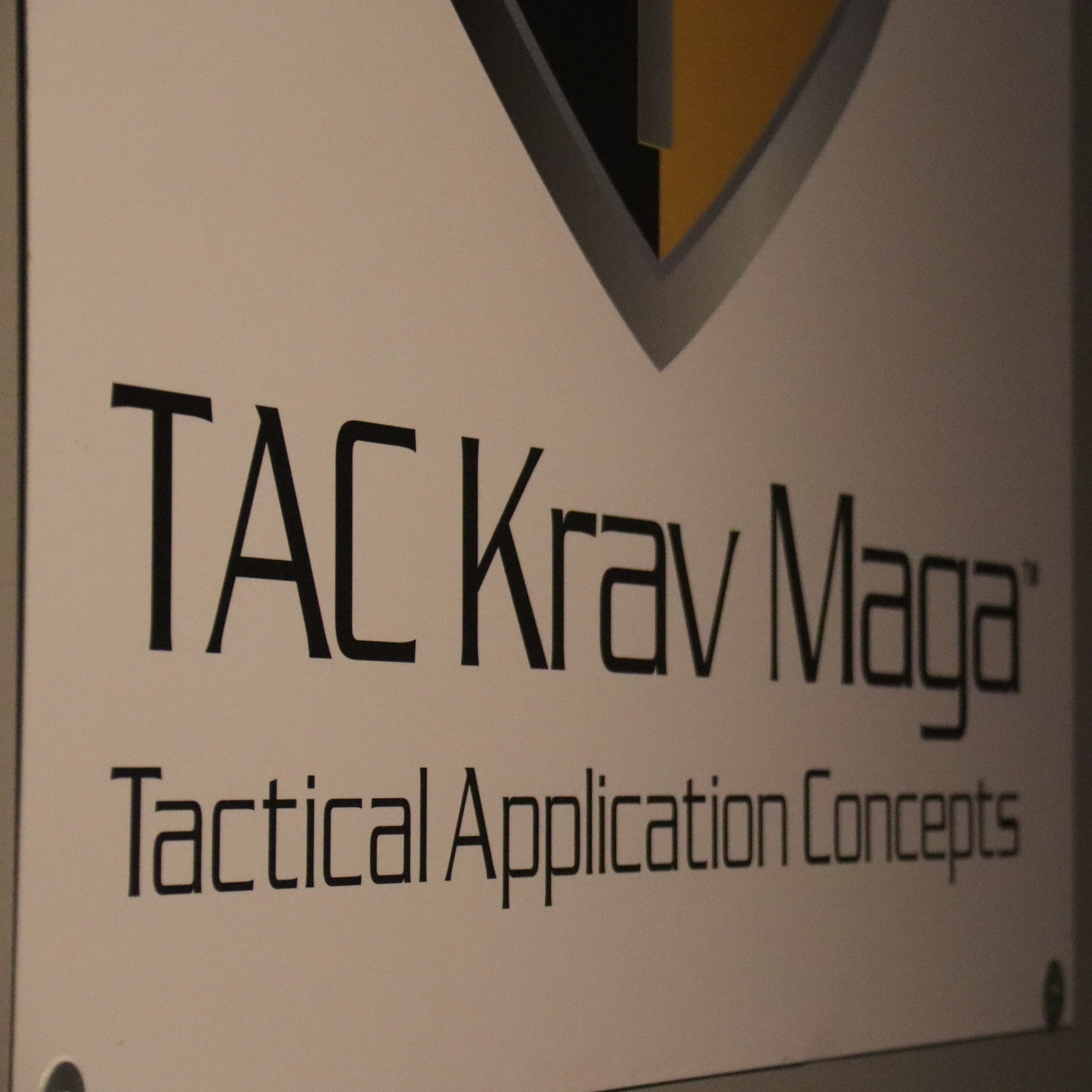 Photo of a sign that reads TAC Krav Maga